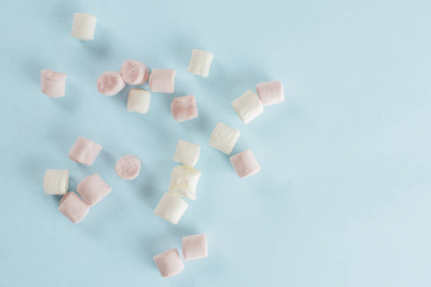 istock Sweet fluffy marshmallow isolated on light blue 1167409998