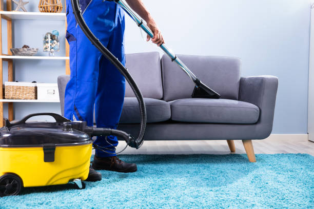 istock Man Cleaning Sofa With Vacuum Cleaner 1167411725