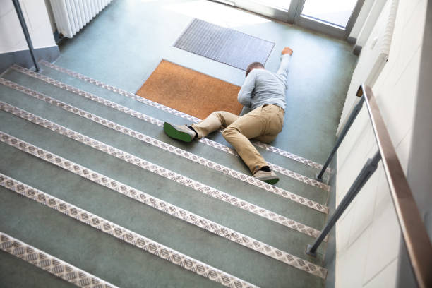 istock Unconscious Man Lying On Staircase 1167411915