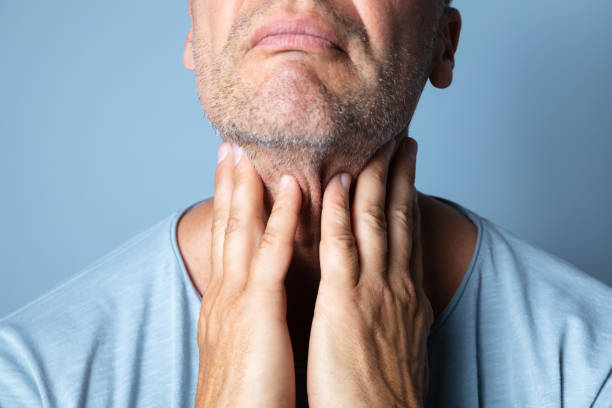 istock Close-up Of A Man Touching His Sore Throat 1167411949