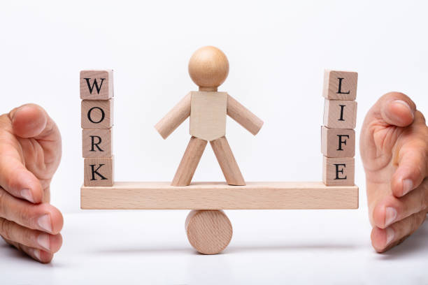 istock Life And Work Blocks Balancing On Seesaw 1167413543
