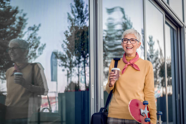 istock Senior business Woman with skateboard 1167417457