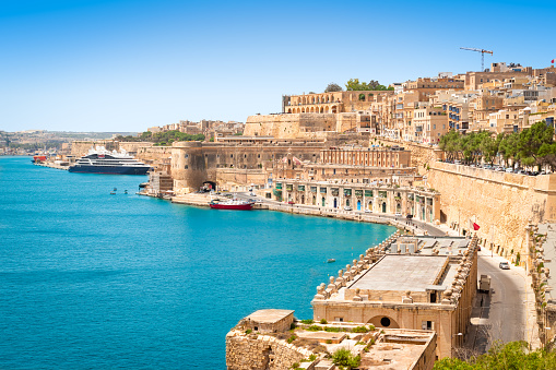 Beautiful landscape of Grand Harbour and medieval defensive walls around the capital city of Valletta in Malta. Popular tourist and cruise destination.