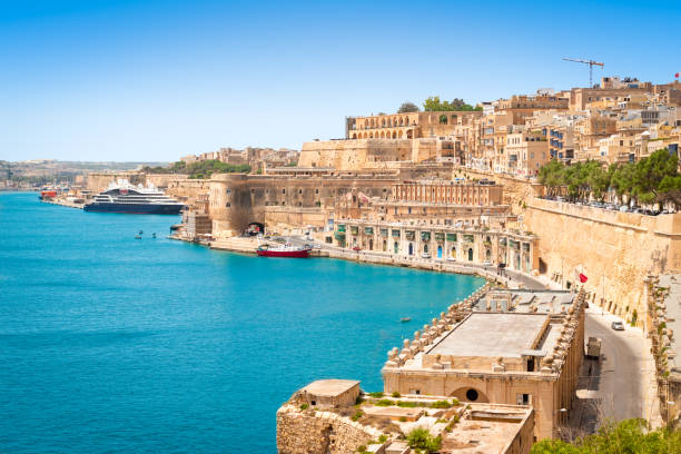 Port of Valletta, Malta Beautiful landscape of Grand Harbour and medieval defensive walls around the capital city of Valletta in Malta. Popular tourist and cruise destination. malta stock pictures, royalty-free photos & images