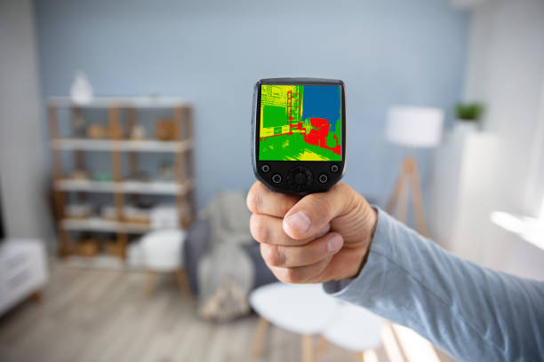 Person Hand Using Infrared Thermal Camera In Living Room
