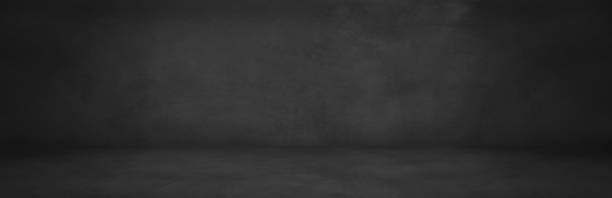 istock dark cement studio and horizontal black concrete showroom with wall 1167418498