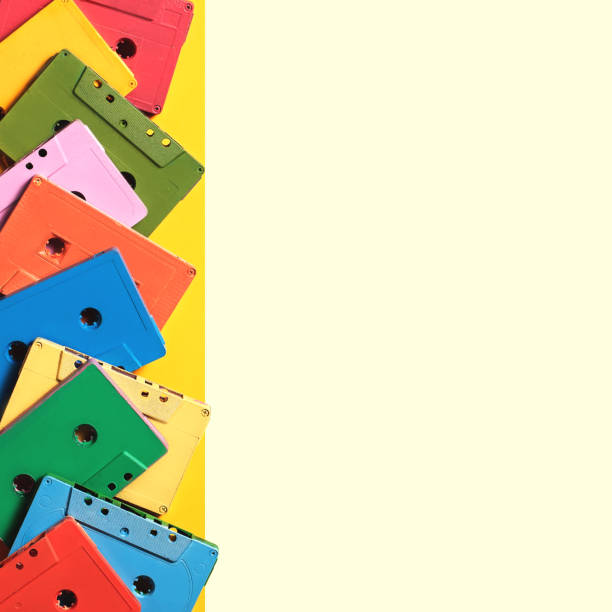 istock Painted audio cassettes on bright multicolor background, copy space, top view. Retro musical background 1167419677