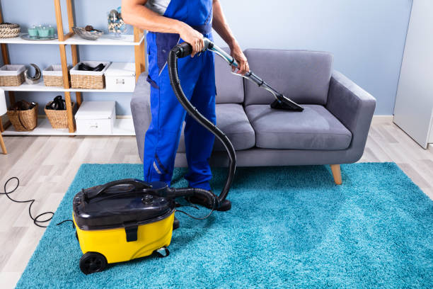 istock Man Cleaning Sofa With Vacuum Cleaner 1167420101