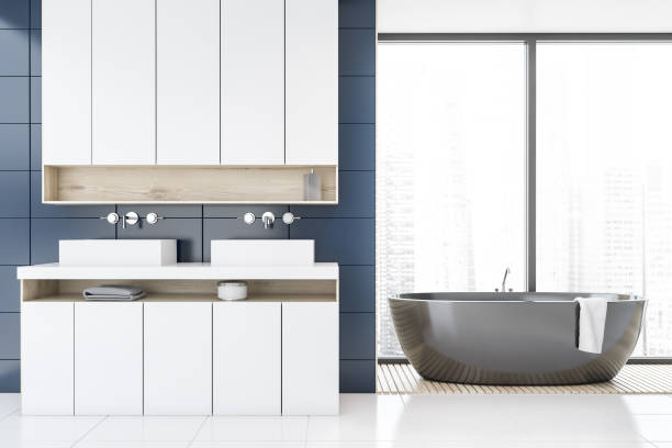 istock Panoramic blue bathroom, tub and double sink 1167421090
