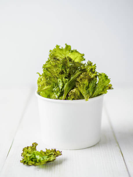 istock Homemade kale chips ready-to-eat, copy space left 1167421396