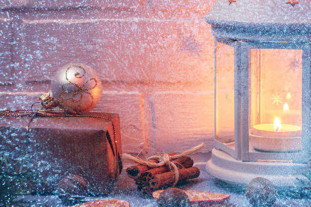 istock Christmas composition - lantern with burning candle and traditional ornaments 1167424171