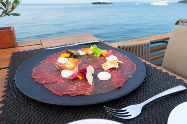 istock Dinner tables near the sea 1167424582