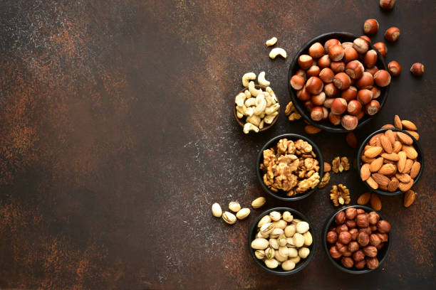 istock Assortment of nuts in a bowls 1167424760