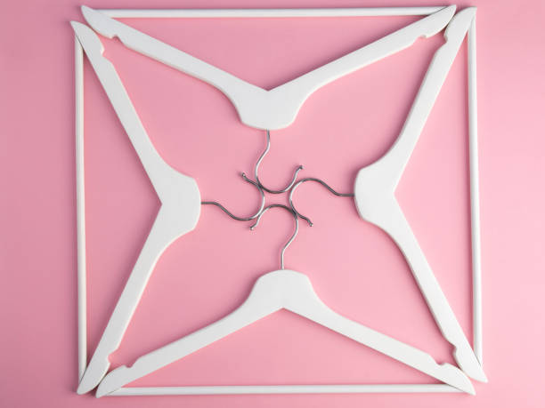 istock White hangers. Flat lay. Hangers background. Hangers pattern 1167427654