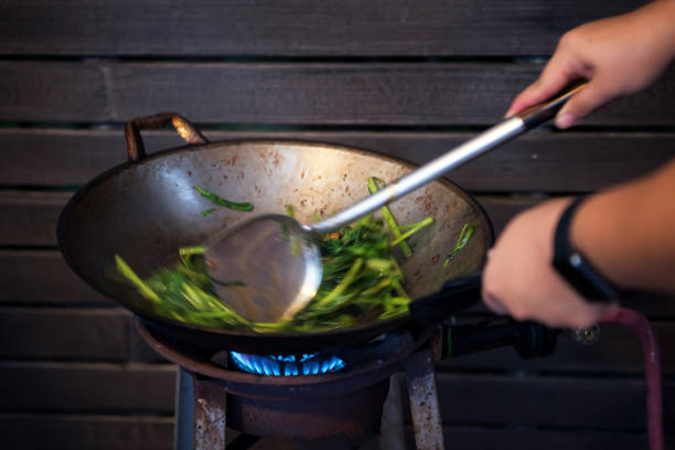 istock cooking swamp cabbage on burning pan 1167428130