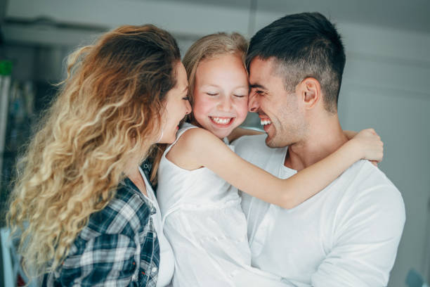 istock Lovely young family with one child at home 1167429607