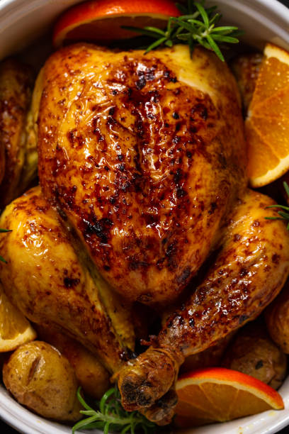 istock Roasted chicken with oranges ,rosemary and potato. Top view 1167429686