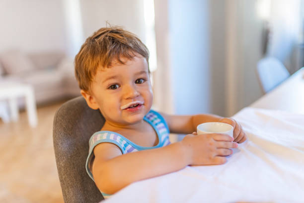 istock Cute baby boy with milk mustache 1167429711