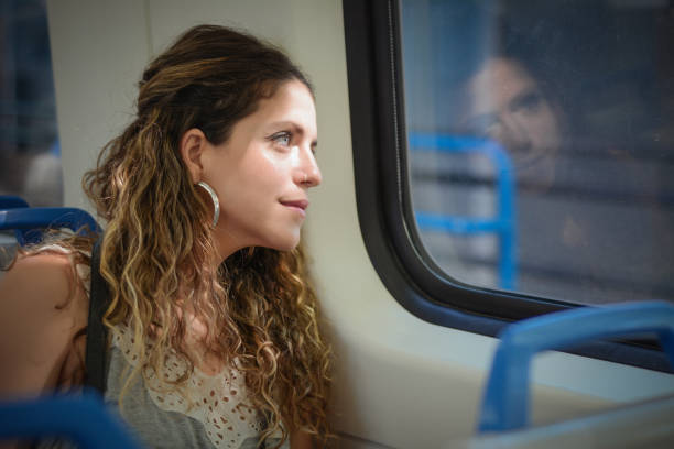 istock Young woman traveling by train 1167430594