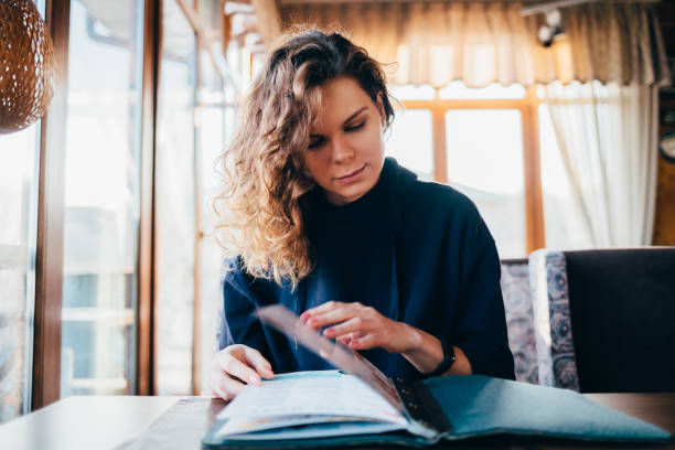 istock Young woman with curly long hair 1167431836