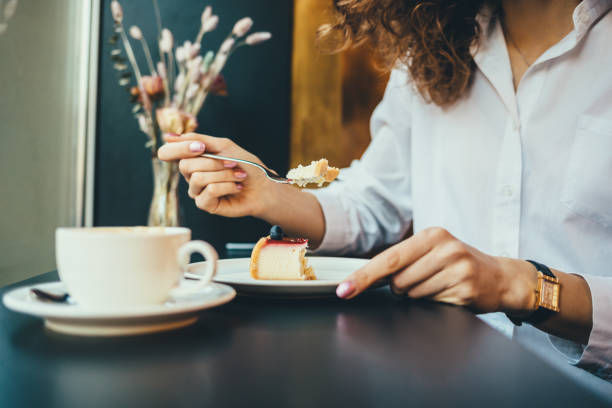 istock Close-up of young woman's hand holding fork 1167431935