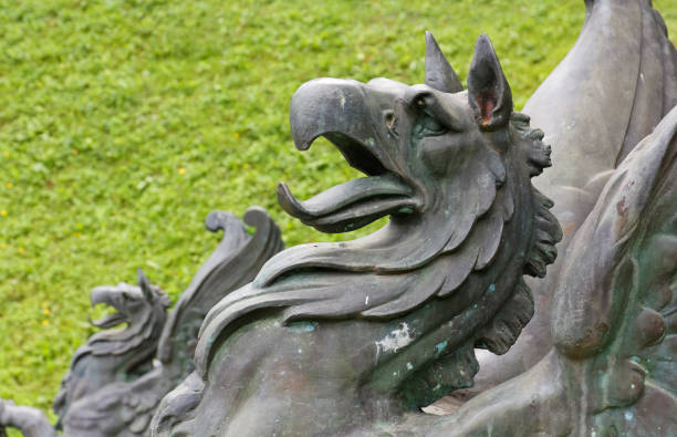 RIMSKE TOPLICE, Slovenia - August 3, 2019: Close-up on the statue of a mythological creature at the entrance of a public park near the spa