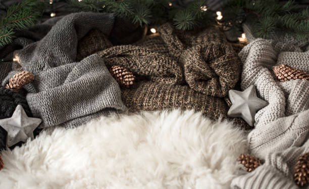 istock Christmas background. knitted sweater and christmas decoration on a light background, top view. Still life 1167432952