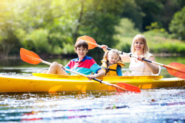 istock Child on kayak. Kids on canoe. Summer camping. 1167433333