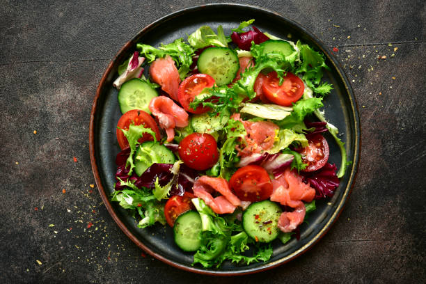 istock Vegetable salad with salmon and salad leaves mix 1167433383