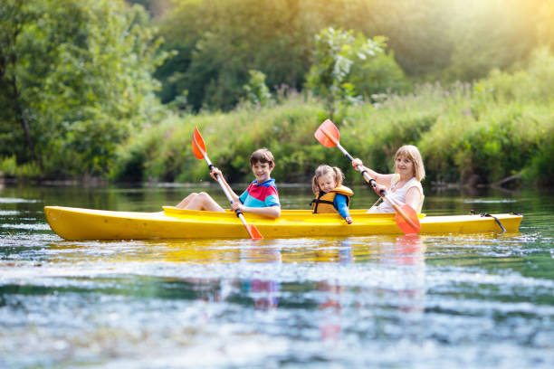 istock Child on kayak. Kids on canoe. Summer camping. 1167433389
