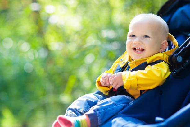 istock Baby boy in stroller in autumn park 1167434615