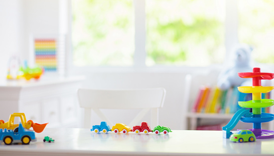 Little boy room. Toy cars at desk. Car toys.