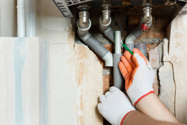 istock A worker is installing the gas boiler pipes. 1167434637