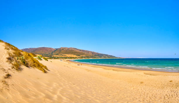 Paloma beach tip. Nature Park of the Strait. Valdevaqueros inlet. Rate, Cadiz. Andalusia, Spain. Punta Paloma beach, a unspoiled white sand beach of The Nature Park del Estrecho. Valdevaqueros inlet. Tarifa, Cadiz. Andalusia, Spain. tarifa stock pictures, royalty-free photos & images