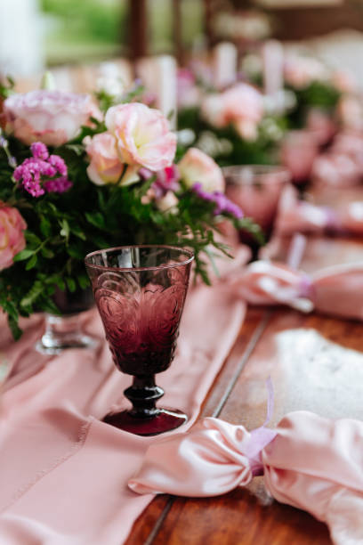 istock Vintage festive table setting with pink roses, candles and cutlery 1167435698