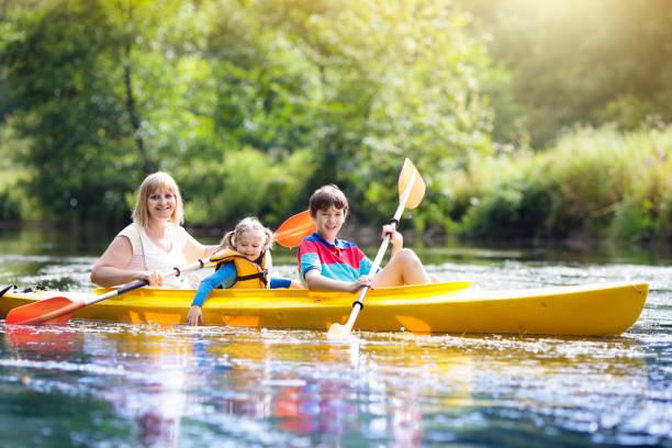 istock Child on kayak. Kids on canoe. Summer camping. 1167435816