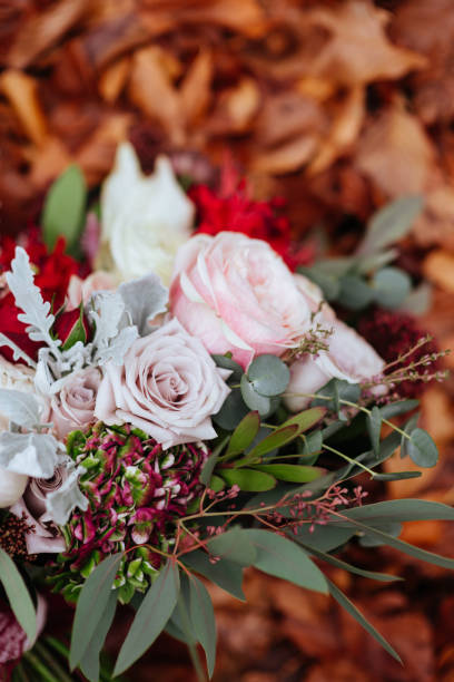istock Bridal Wedding Bouquet on Autumn foliage background, 1167435854