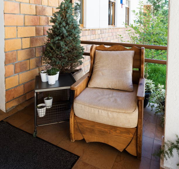 istock Soft chair base tree on street with a table and Christmas tree 1167439485
