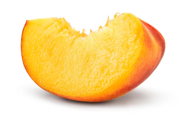 istock Peach slice on white background. Sliced peach isolated. 1167443442