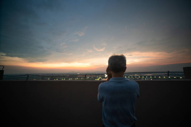 istock one old man standing in the roof looking forward 1167447649