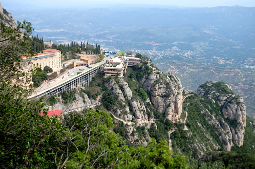 Santa Maria de Montserrat Abbey in Monistrol de Montserrat Monastery view from above located nearby from Barcelona in Catalonia, Spain