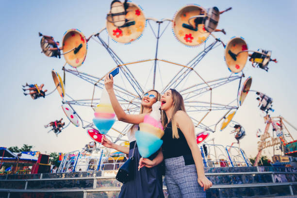 istock Friends in amusement taking selfie 1167449002