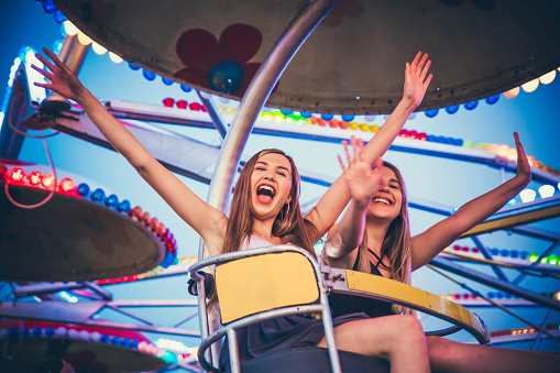 Young women having fun in an amusement park