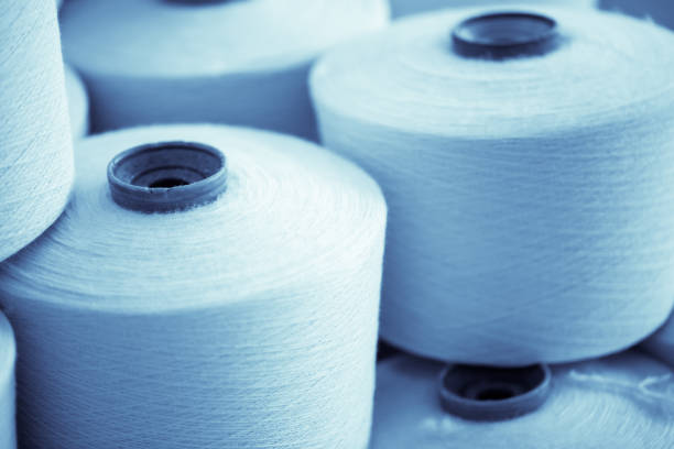istock spindle with white yarn in the jean factory 1167449677