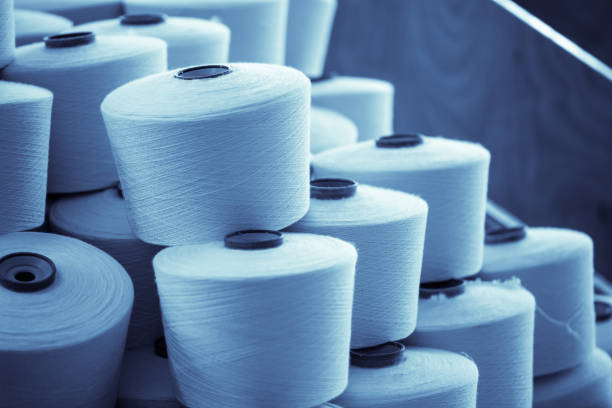 istock spindle with white yarn in the jean factory 1167449681