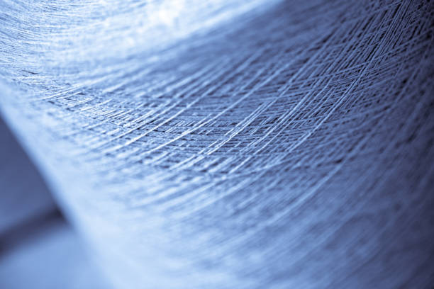 istock spindle with white yarn in the jean factory 1167450346