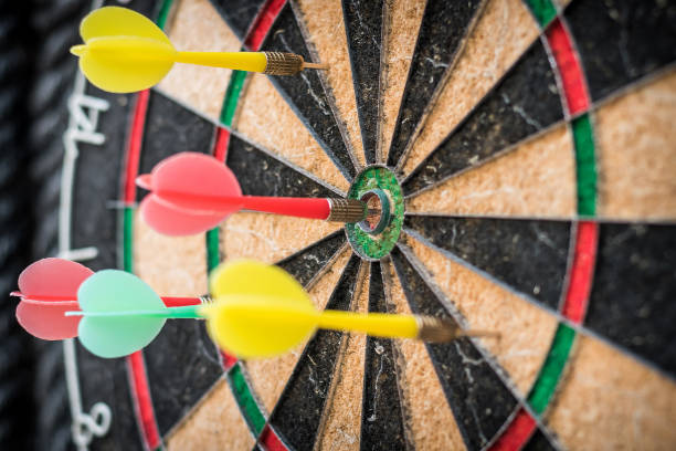 istock Target dart game with one win arrow hit on middle point spot and many missing for competitive business marketing concept 1167452814
