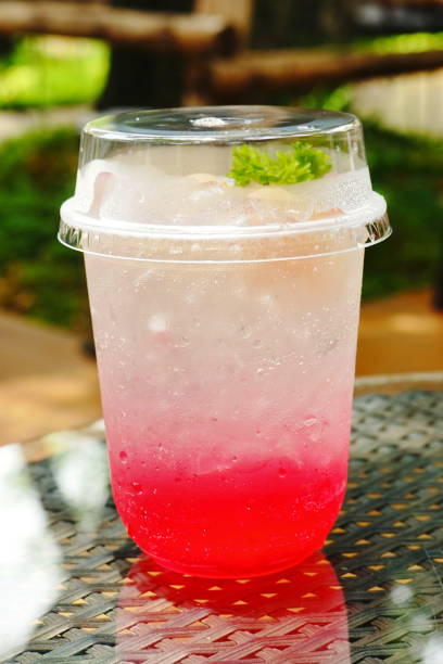 Cool red soda water in plastic glass