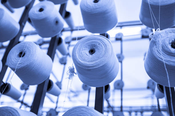 istock spindle with white yarn in the jean factory 1167453007