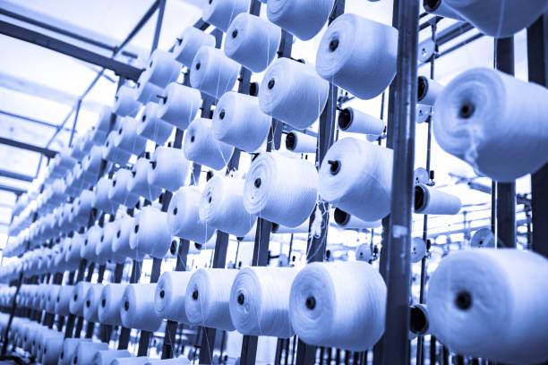 istock spindle with white yarn in the jean factory 1167453018